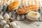 Homemade baked bakery or dessert, a variety of Hong Kong style bread or bun place on a cooling rack on striped placemat