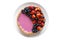 Homemade baked berry pie cake with strawberry and blueberry on white plate on white background flat lay top view