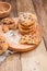 Homemade baked rye flour for breakfast. Cookies with chocolate on a wooden plate. Free space for text. Vintage photo