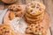 Homemade baked rye flour for breakfast. Cookies with chocolate on a wooden plate. Free space for text. Vintage photo