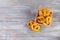 Homemade baked salt pretzel on wooden background. Oktoberfest concept