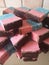 Homemade baking pink blue coconut ice bars topped with chocolate recipe