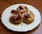 Homemade banana and oat pancakes with strawberries and almonds