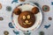 Homemade bear cake with face made of banana. Cute chocolate cake in teddy bear face for child dessert