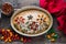 Homemade and beautiful italian focaccia in round baking bowl. Decoration that looks like flowers in garden is made of