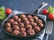 Homemade beef meatballs in cast-iron skillet