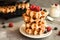 Homemade Belgian waffles with forest fruits, blueberries, raspberries and yogurt.