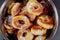 Homemade berliner donuts on plate with sugar in bowl