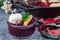 Homemade berry cobbler in glass ramekin with ice cream, Christmas decoration, horizontal