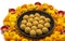 Homemade besan laddoo with flowers kept with rangoli