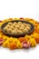 Homemade besan laddoo with flowers kept with rangoli