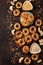 Homemade birdseed dumplings, winter food for birds, dark wooden background, top view