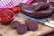 Homemade blood sausage with tomato sauce on wooden board