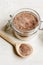 Homemade body peeling cocoa-sugar on wooden background close up