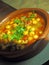 Homemade bowl garbanzo bean soup with fresh basil as served in