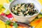 Homemade brazilian tropical salad with banana, herbs and raisins