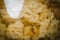 Homemade bread kvass with leaven and malt in a glass mug on a wooden board close-up, selective focus