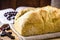 Homemade bread made in the Easter and Eucharist period, called Christ bread, religious symbol, with Bible and crucifix in the