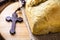 Homemade bread made in the Easter and Eucharist period, called Christ bread, religious symbol, with Bible and crucifix in the