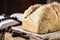 Homemade bread made in the Easter and Eucharist period, called Christ bread, religious symbol, with Bible and crucifix in the