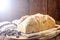Homemade bread made in the Easter and Eucharist period, called Christ bread, religious symbol, with Bible and crucifix in the