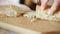 Homemade Bread slicing onto thin slices using sharp knife