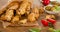 Homemade BreadSticks on a rustic wooden board.