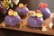 Homemade bright mousse cakes `Hearts` with purple mirror icing