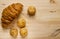 Homemade bun on wood background, croissant puff cinnamon, breakfast food