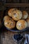 Homemade buns with linseed sunflower seeds for breakfast with butter and blueberry jam