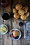 Homemade buns with linseed sunflower seeds for breakfast with butter and blueberry jam