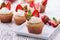 Homemade buttercream cupcakes with strawberries