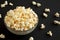 Homemade Buttered Popcorn with Salt in a Bowl on a black background, low angle view