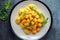 Homemade Butternut squash gnocchi with wild rocket in a plate