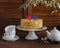Homemade cake on a ceramic stand for the cake, tea set, paper hearts, a flower. Valentine\'s day romantic Breakfast.