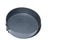 Homemade cake making or baking. Round metal cake pan, tin for baking cakes and cookies. Black collapsible stainless steel round