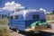 A homemade camper driving down the road to Taos, New Mexico