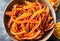 Homemade candied orange peel in a bowl