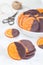 Homemade candied sliced oranges covered with chocolate,  making sweet gifts, vertical