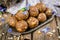 Homemade candies with dates and walnuts on vintage try and wooden background. East sweets for ramadan. Selective focus