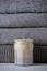 homemade candle with gray knits