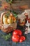 Homemade canned tomatoes in glass jars in a rustic style. The concept of cultivation, harvesting and preservation of vegetables.