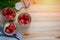 Homemade canned tomatoes in glass jars for winter on wooden background. Fermented vegetables, homemade conservation, top view, spa