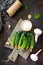 Homemade canned vegetables. Preservation of fresh and pickled cucumbers, garlic and spices on the kitchen table.