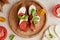 Homemade caprese sandwich, Italian starter with fresh mozzarella, tomatoes, basil leaves close up. Mediterranean classic