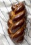 Homemade challah jewish bread on cloth, top view. Flat lay, overhead, from above. Close-up