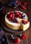 Homemade cheese cake with strawberry and winter berries. New York Cheesecake. Christmas dessert. Healthy food.