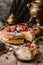 Homemade cheesecake or cottage cheese casserole with berries and icing sugar on rustic wooden table with samovar and teapot