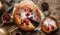 Homemade cheesecake or cottage cheese casserole with berries and icing sugar on rustic wooden table with samovar and teapot,