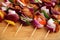 Homemade Chicken and Bacon Skewers Kebabs with Peppers Onions and Herb Marinate on wooden background